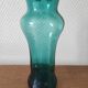 Blown glass vase with a flared neck and wavy rim.