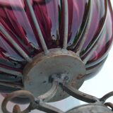 Large blown glass and wrought iron vase on shower stand