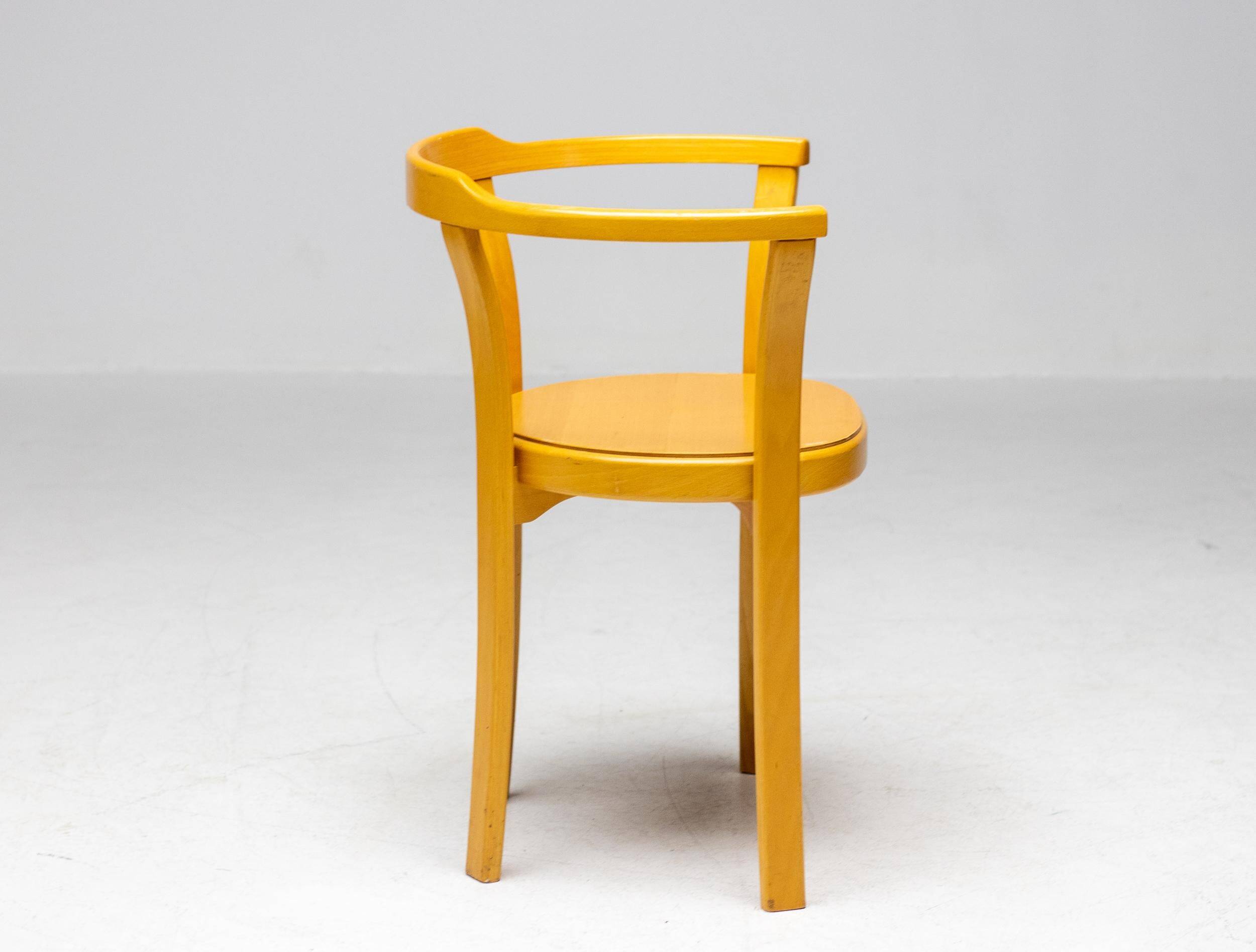 Stackable chairs in curved beech.