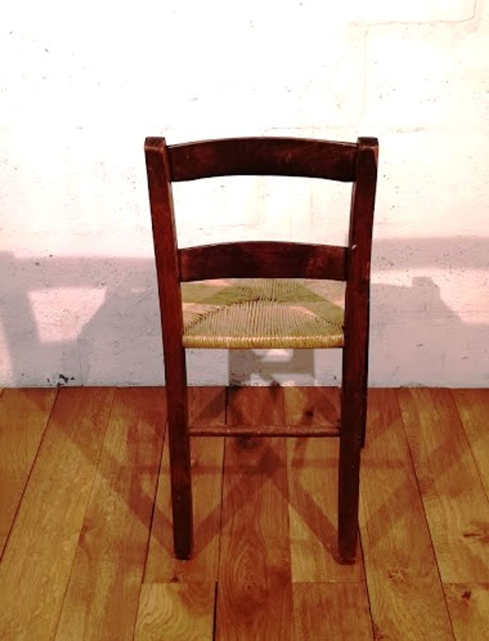 Vintage children's chair in wood and straw