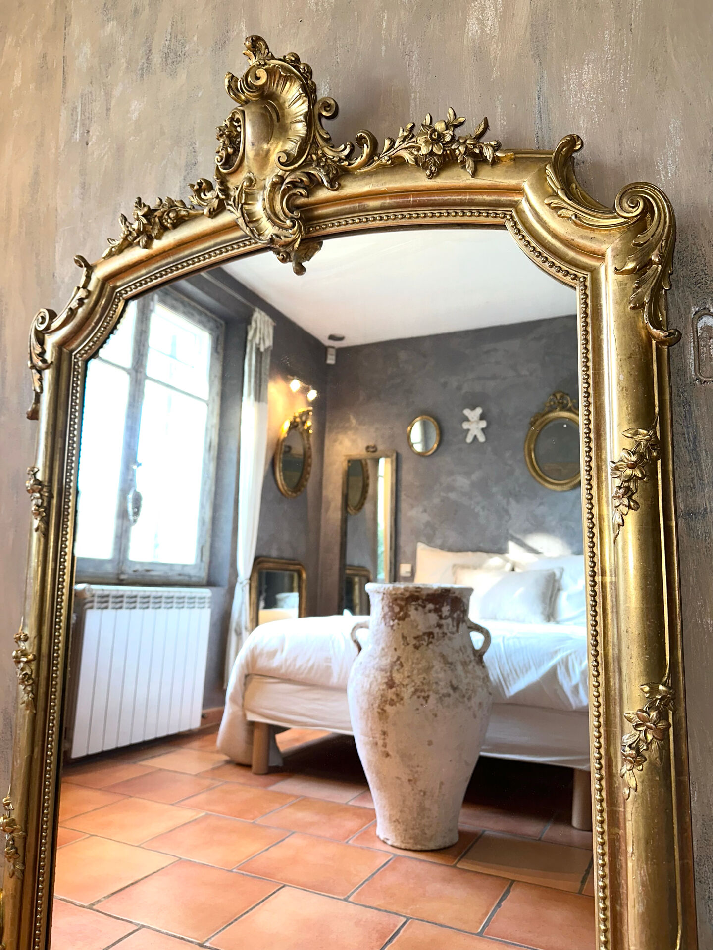 19th-century gilded antique pediment mirror