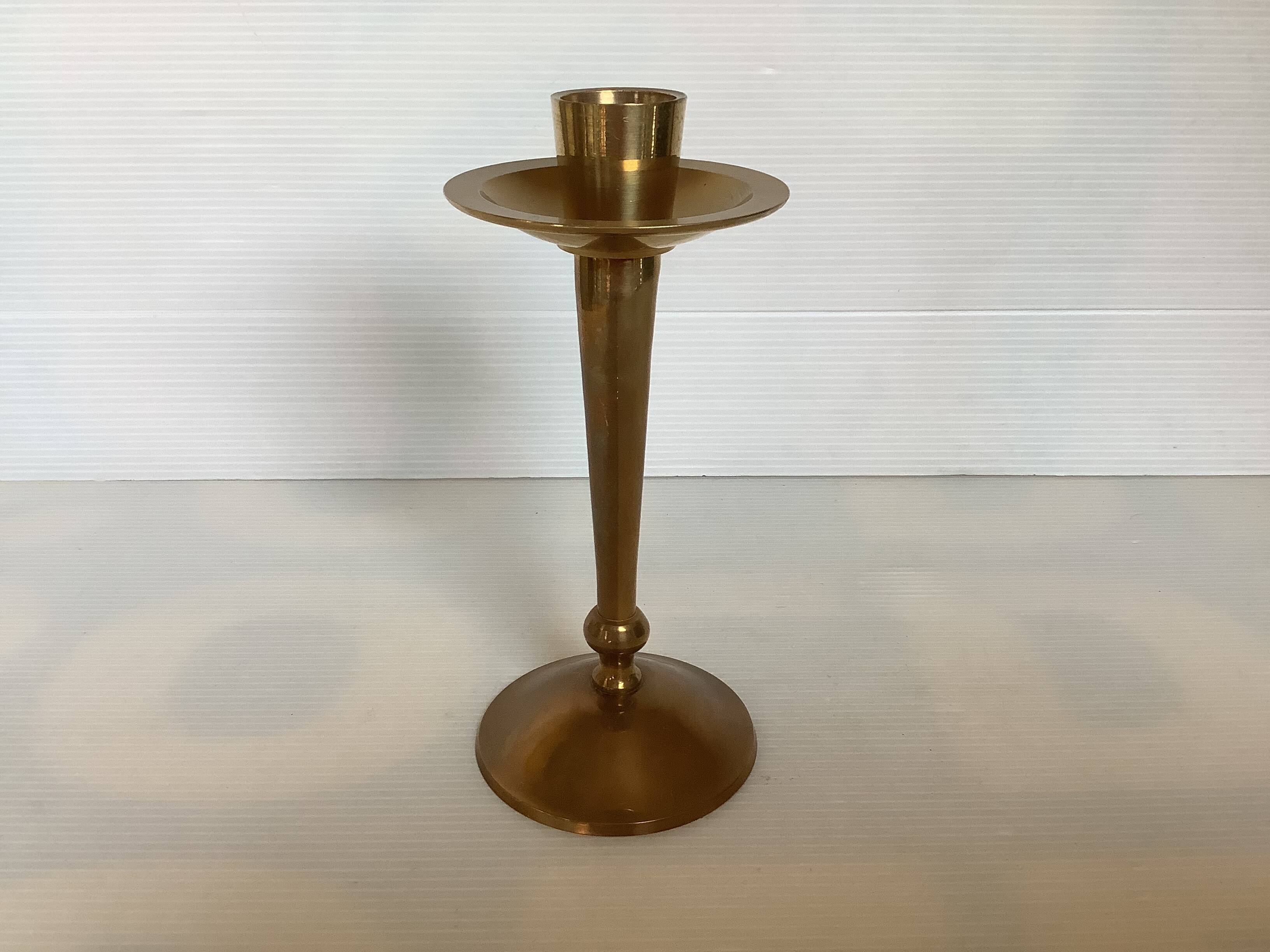 Asymmetrical brass candle holder