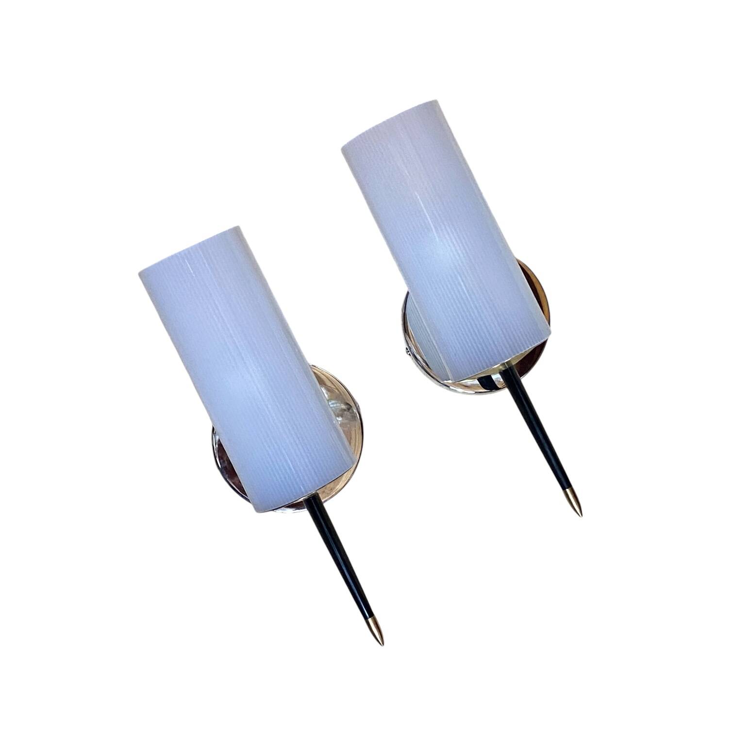 Pair of vintage wall sconces in plexiglass plastic and brass.