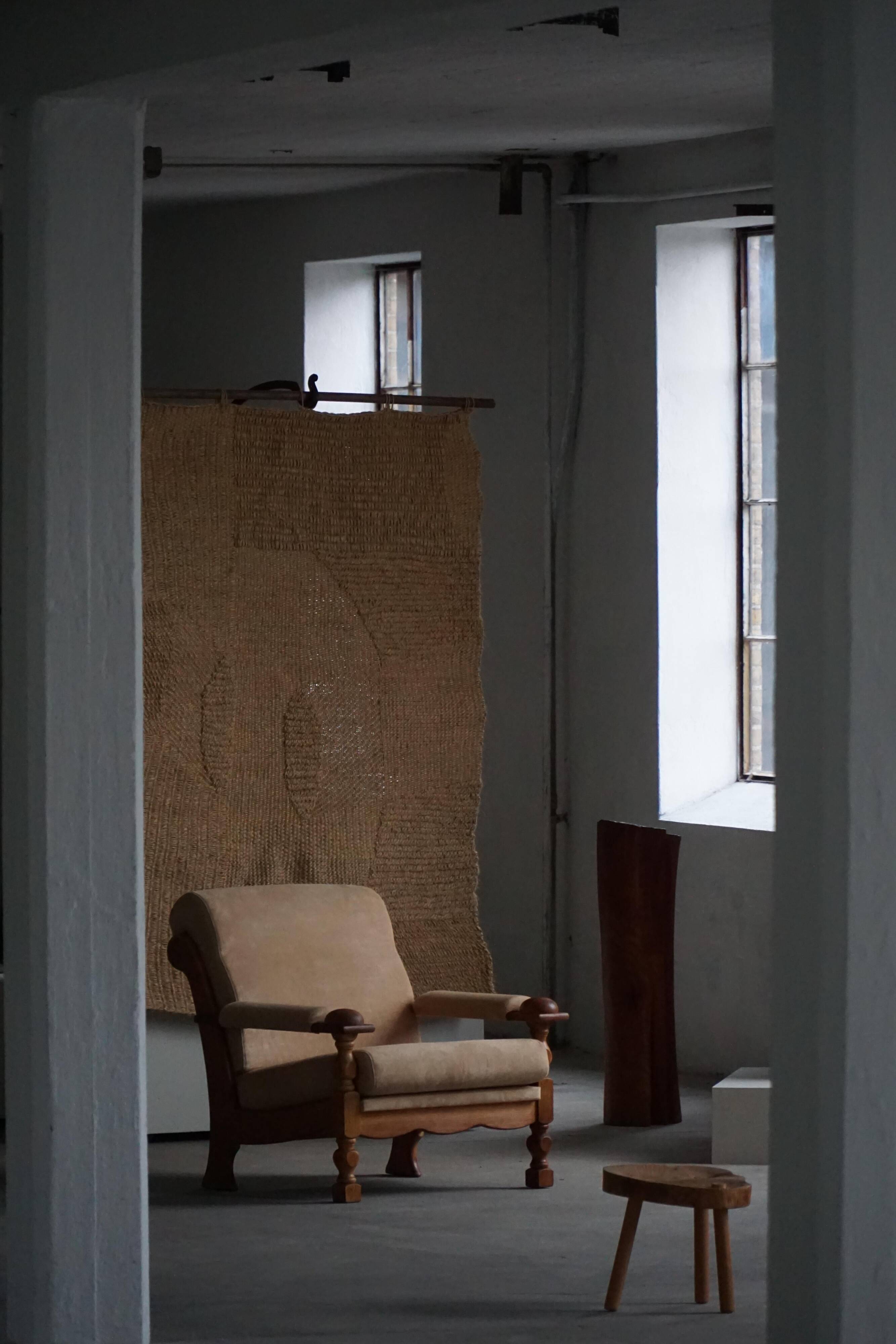 Mid-20th century, pair of armchairs by Henning Kjærnulf, oak and alcantara, 1960s.