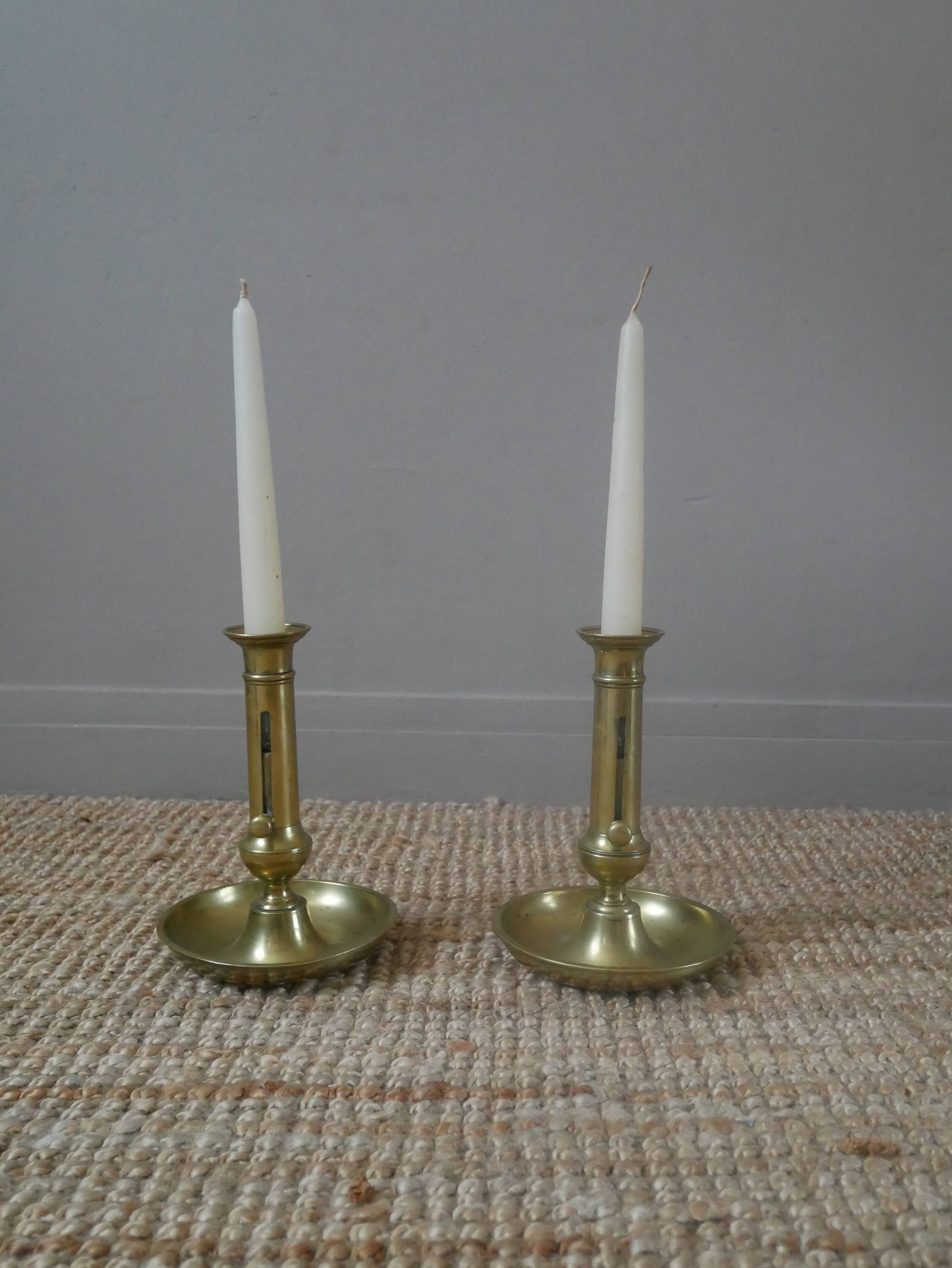 Pair of brass push-button candlestick holders in gold metal, bohemian country decoration