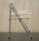 Metal and lucite folding chair, swivel backrest.