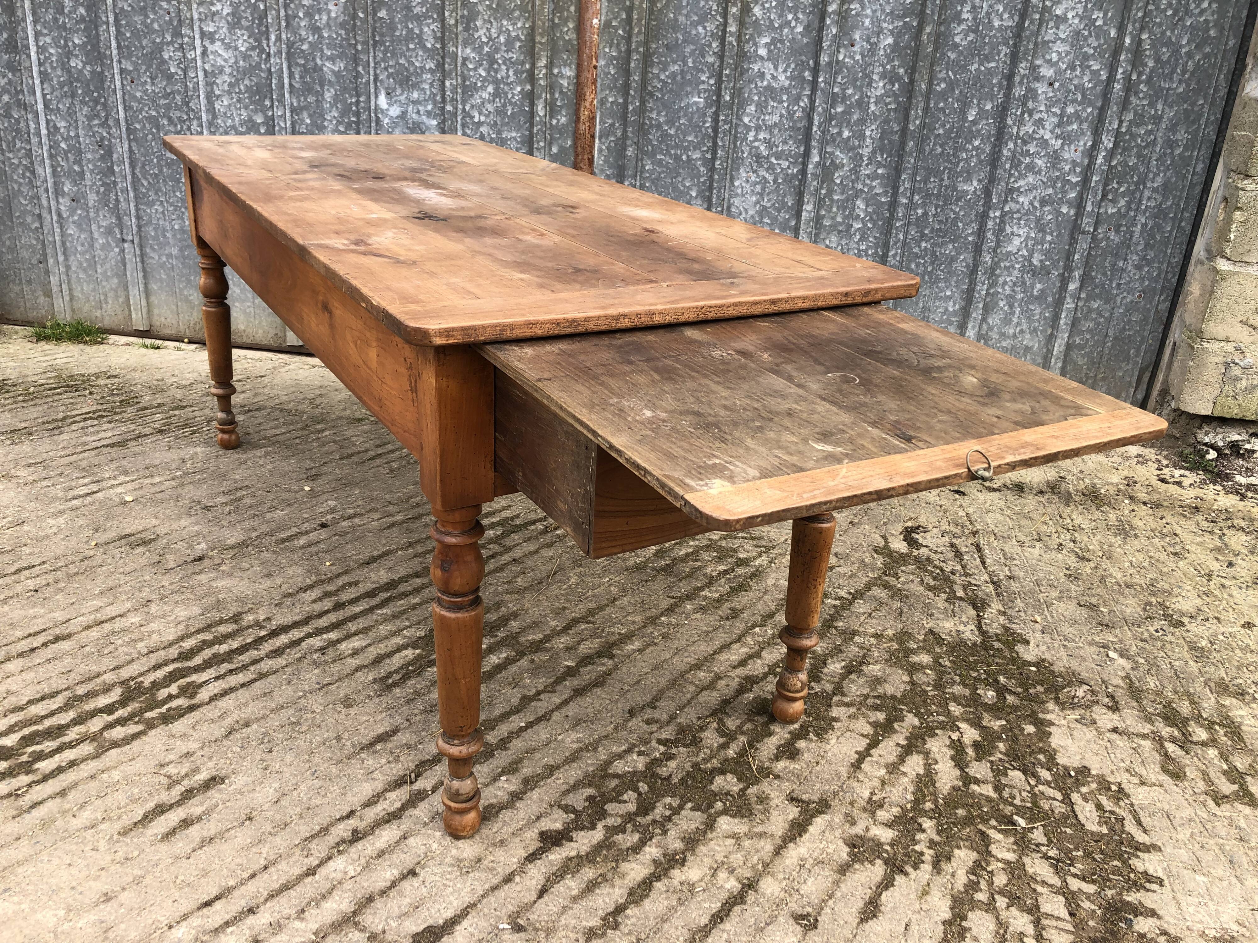 Antique cherry farmhouse table with 2 drawers and 1 pull-out