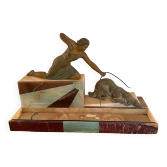 Sculpture of a woman with a greyhound