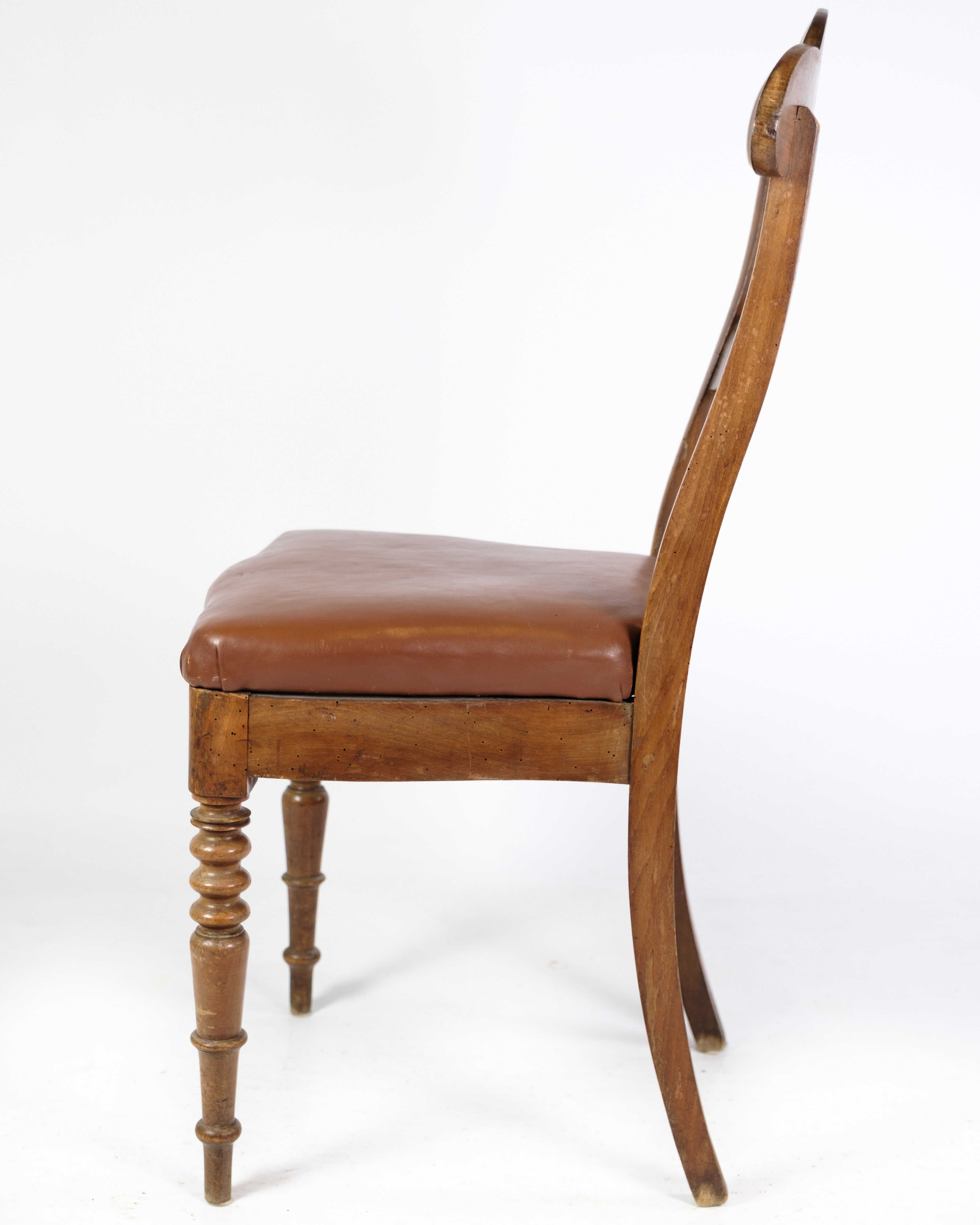 Set of eight late empire chairs in high quality brown leather in mahogany