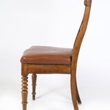 Set of eight late empire chairs in high quality brown leather in mahogany