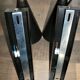 Pair of modernist sconces in black and gold metal