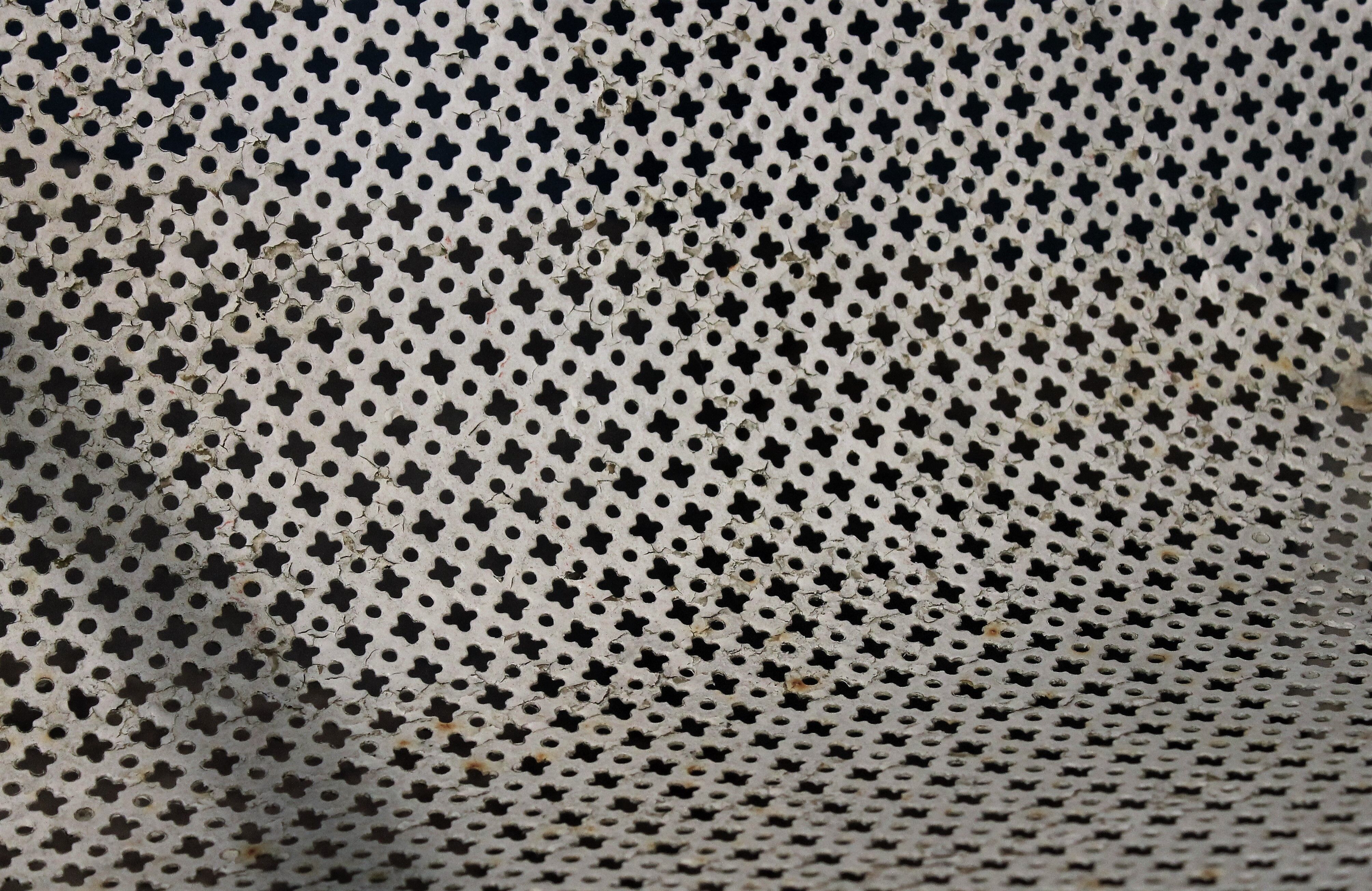 1960 perforated metal garden armchairs
