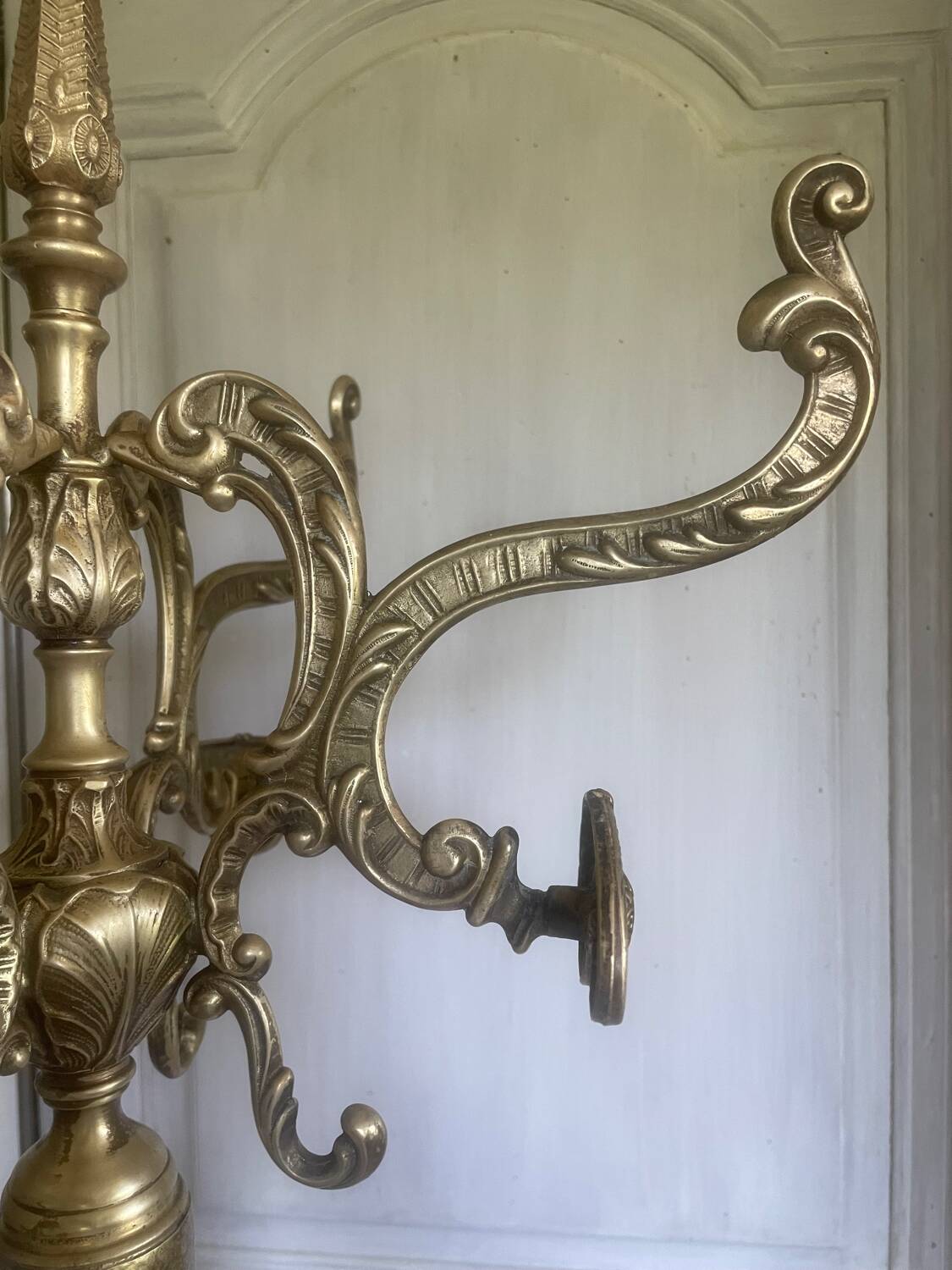 Freestanding brass coat rack