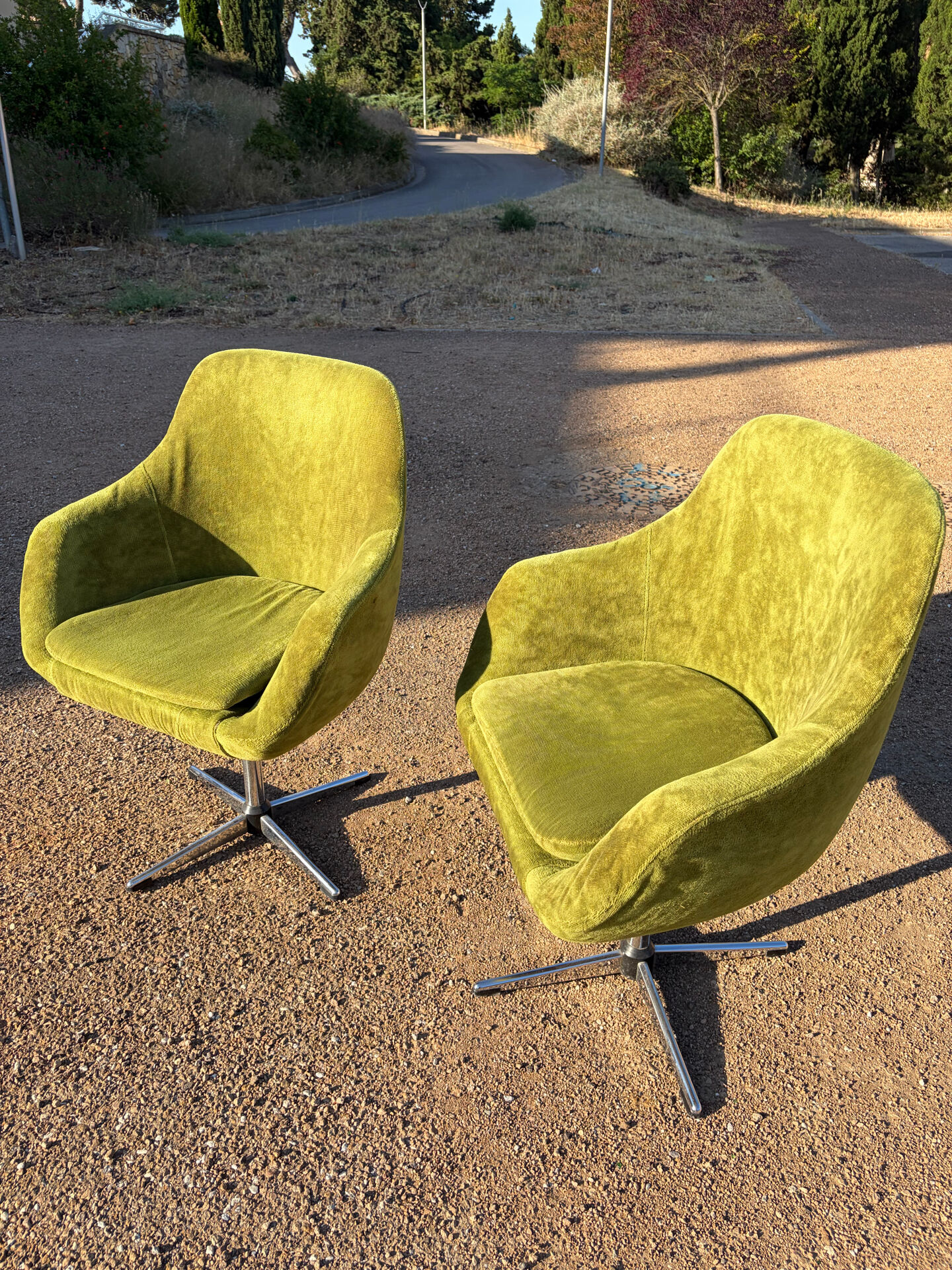 Vintage 1960s Lubke green velvet swivel armchair pair.