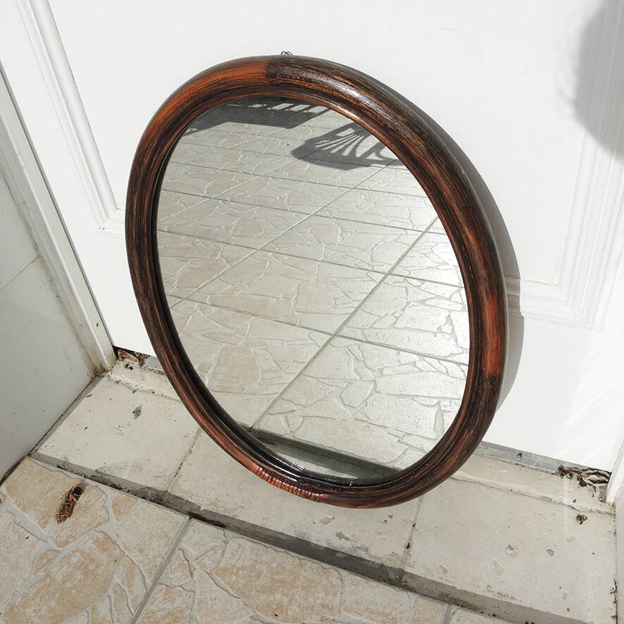 Vintage oval rattan mirror
