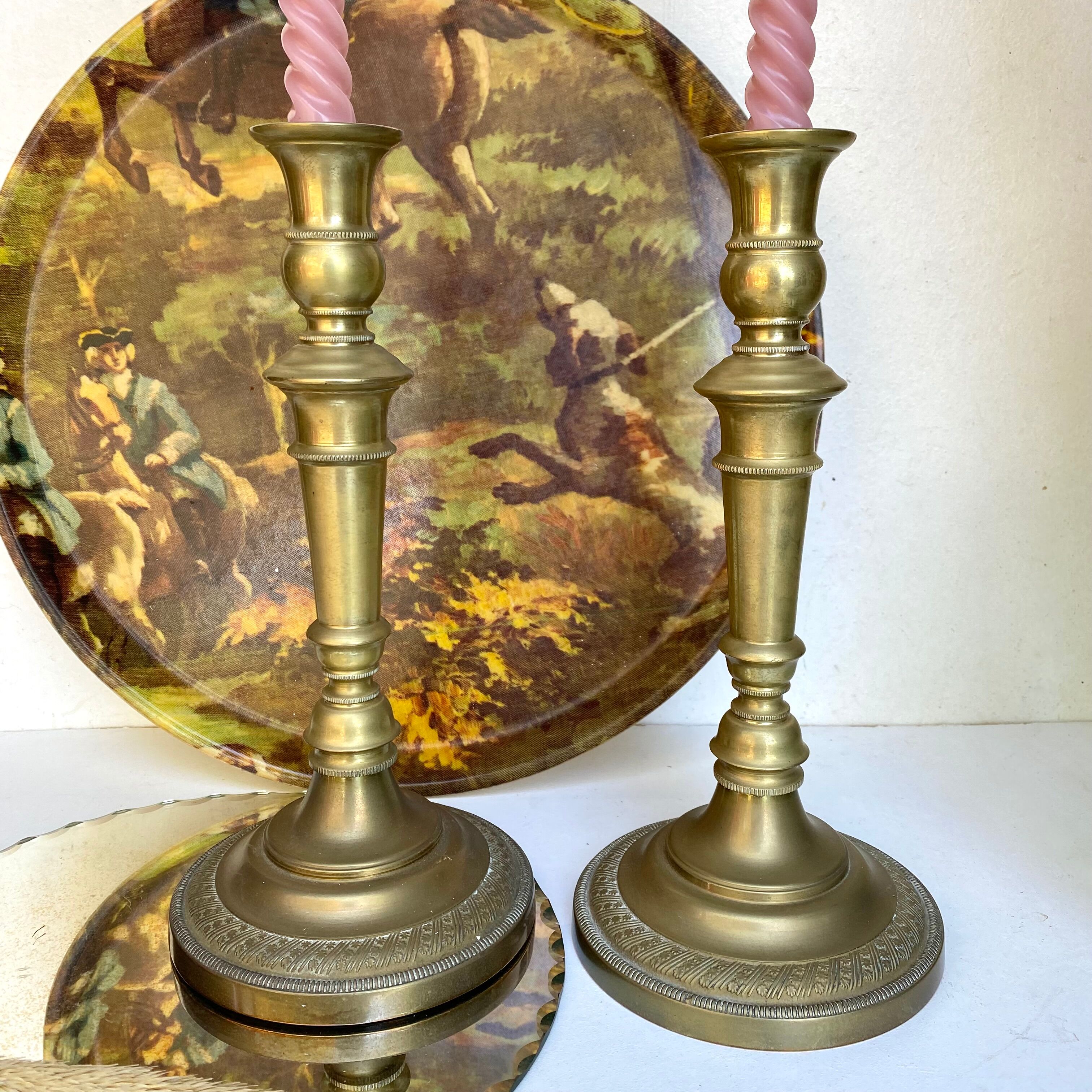 Pair of old candle holders in golden brass