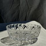 Circular glass ashtray with stylized petal patterns