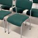 Set of 5 green padded vintage stackable chairs.