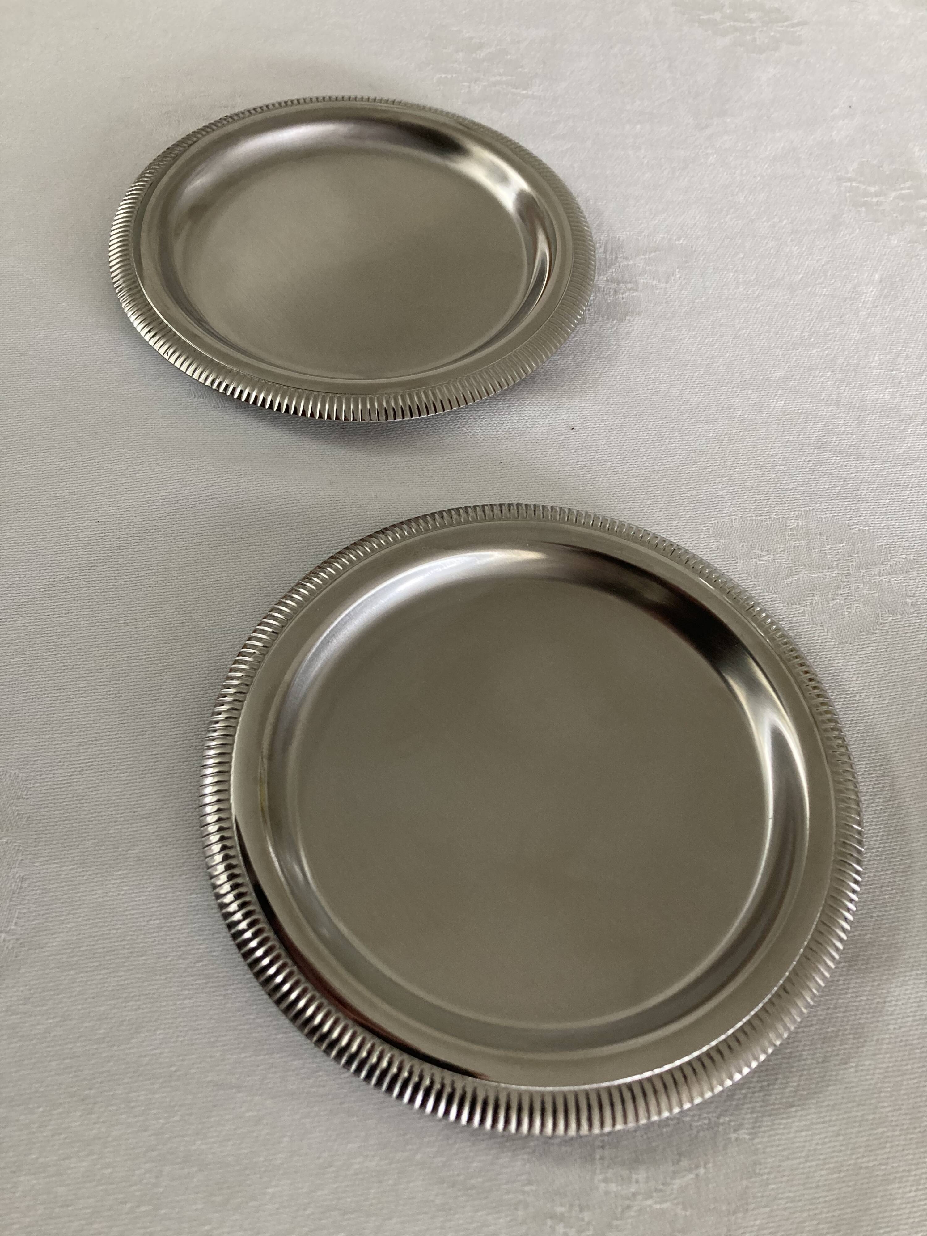 Pair of stainless steel bottle coasters létang and rémy