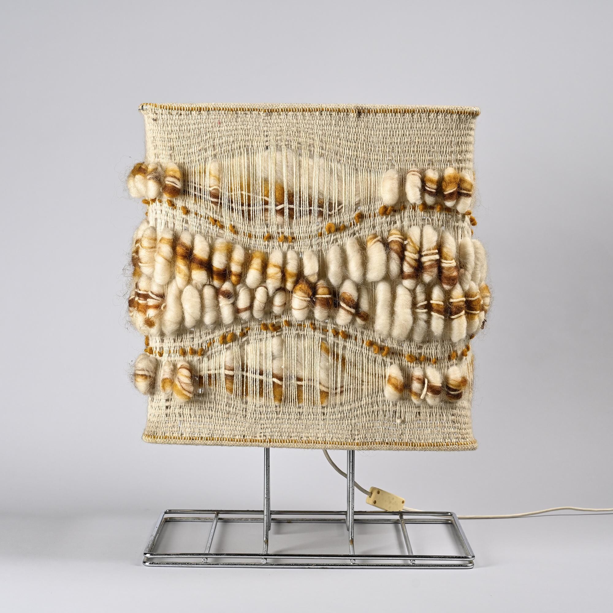 Woven textile and chrome metal table lamp by Max Sauze, circa 1970.