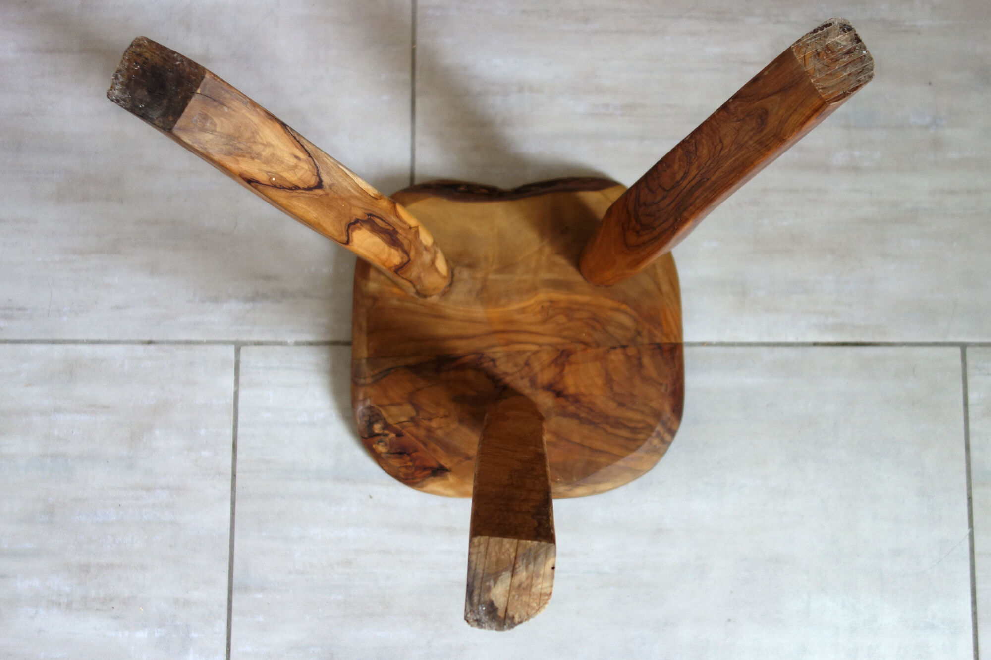 Brutalist stool made of olive wood