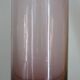 Plum-colored glass bottle with bubble