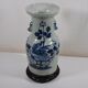 China. Porcelain mallet vase with blue and white phoenix decoration on a rock.