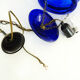 Suspension chandelier, oriental blue glass lantern and brass structure. Year 70-80