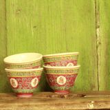 Chinese pink mu shou teapot and its cups