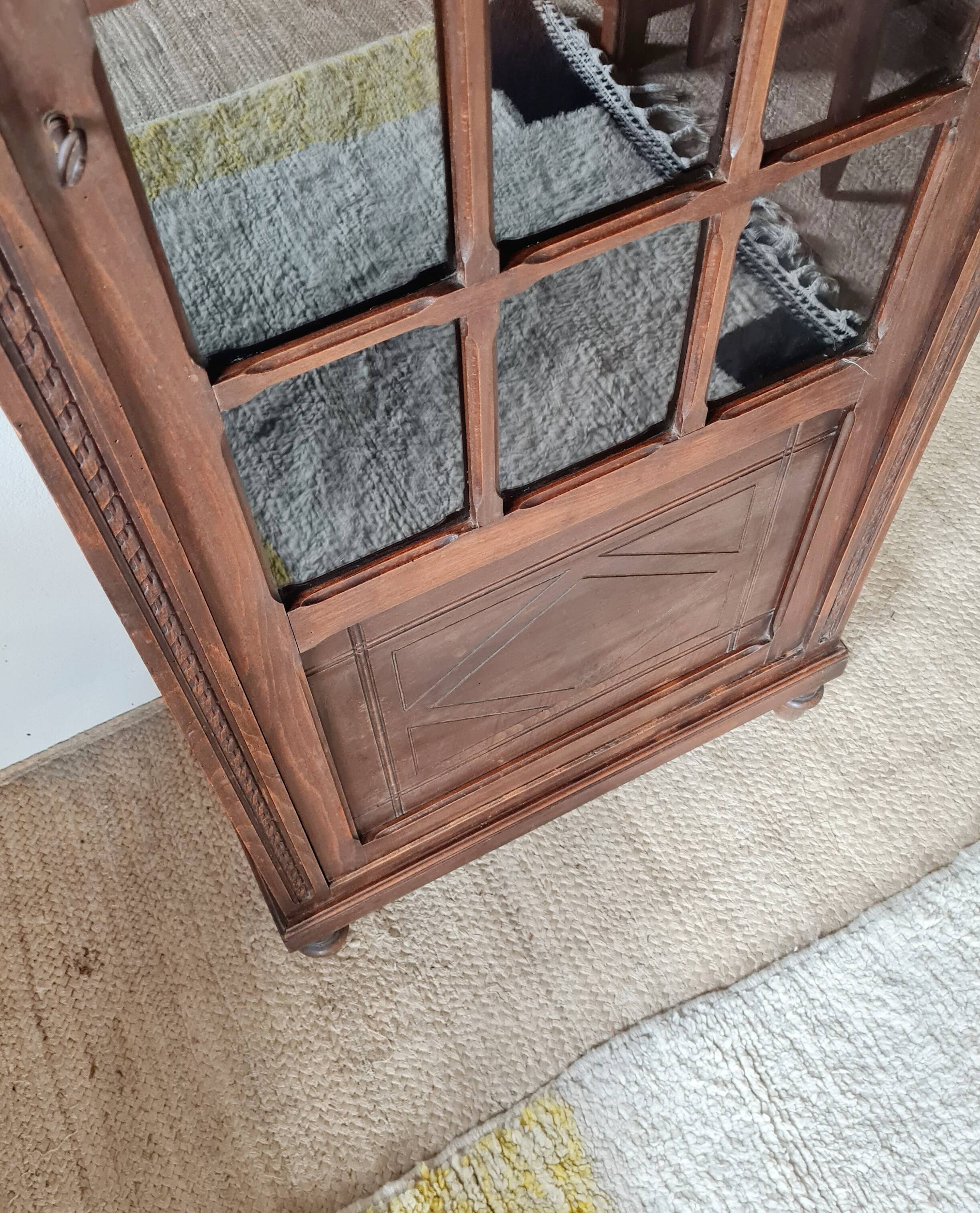 Old glass-fronted library in solid wood