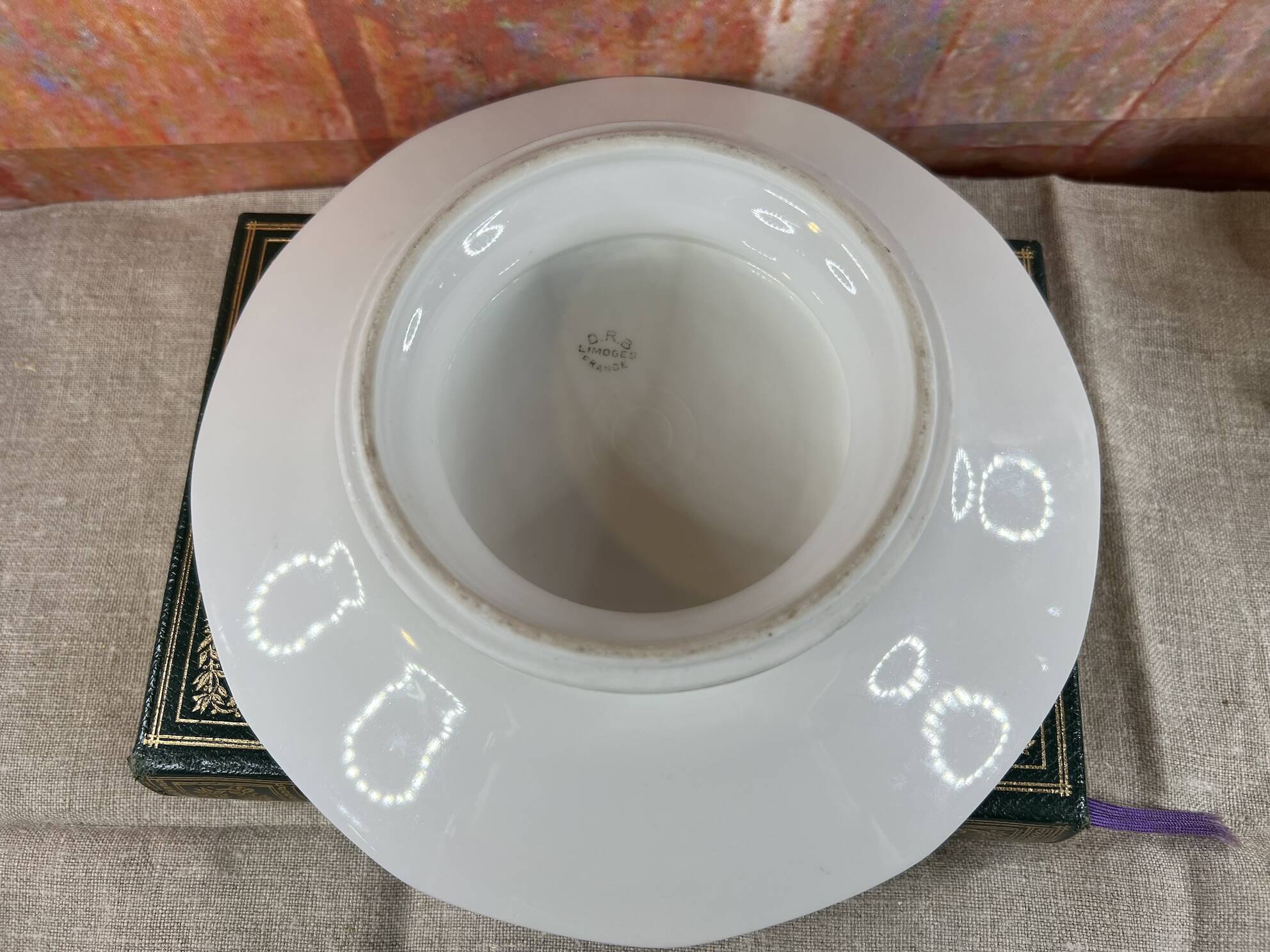 Cup on foot display in Limoges porcelain