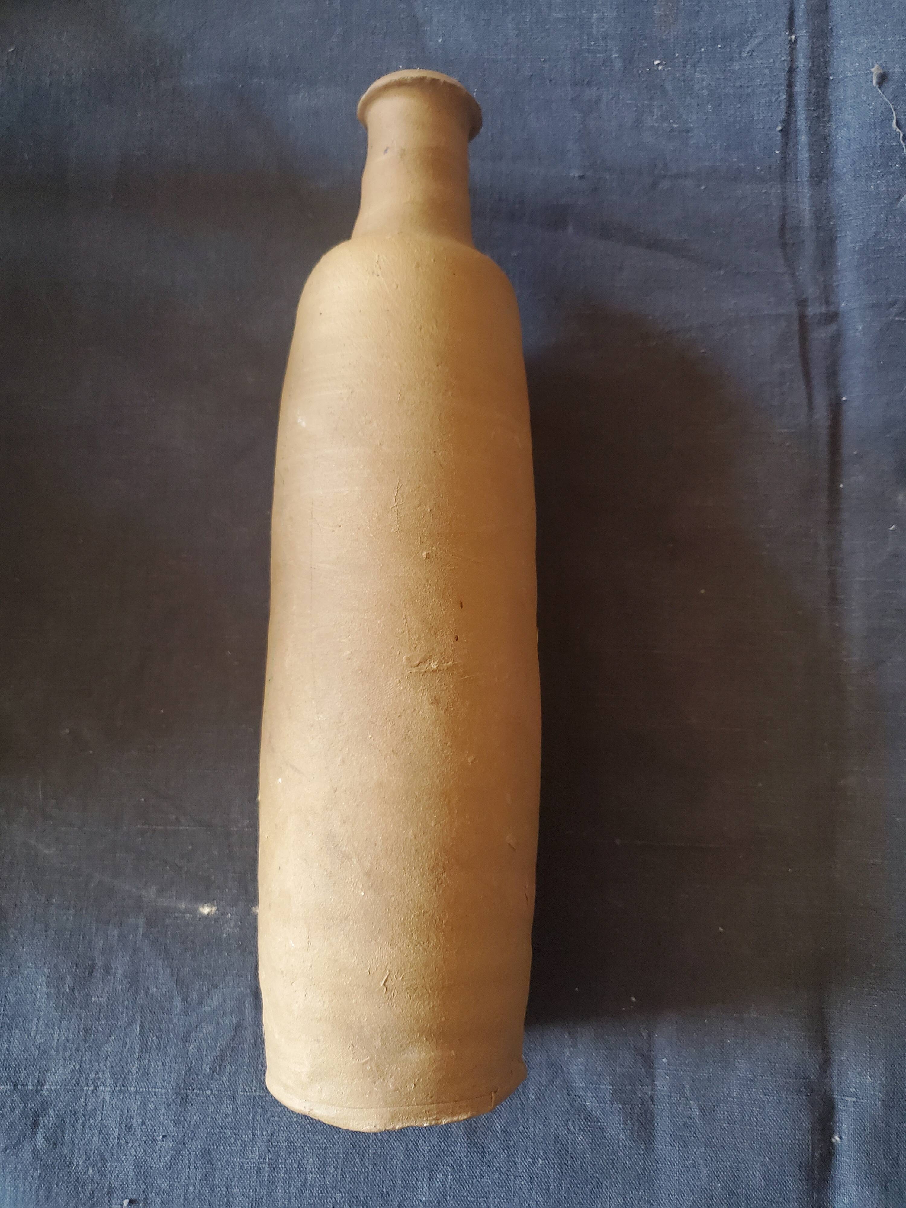 3 terracotta bottles