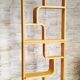 Two screens, partition walls, curved beech wood shelves.