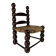 Brutalist wood turned bobbin low rush chair n the style of Charles Dudouyt