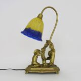 Vintage bronze table lamp featuring a painter on a mirror from the 1960s.