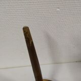 Tripod healer braun formica carries plant