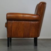 Fauteuil en cuir de mouton à l'aspect luxueux