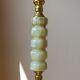 Lamppost in veined onyx and brass metal of the 1960s