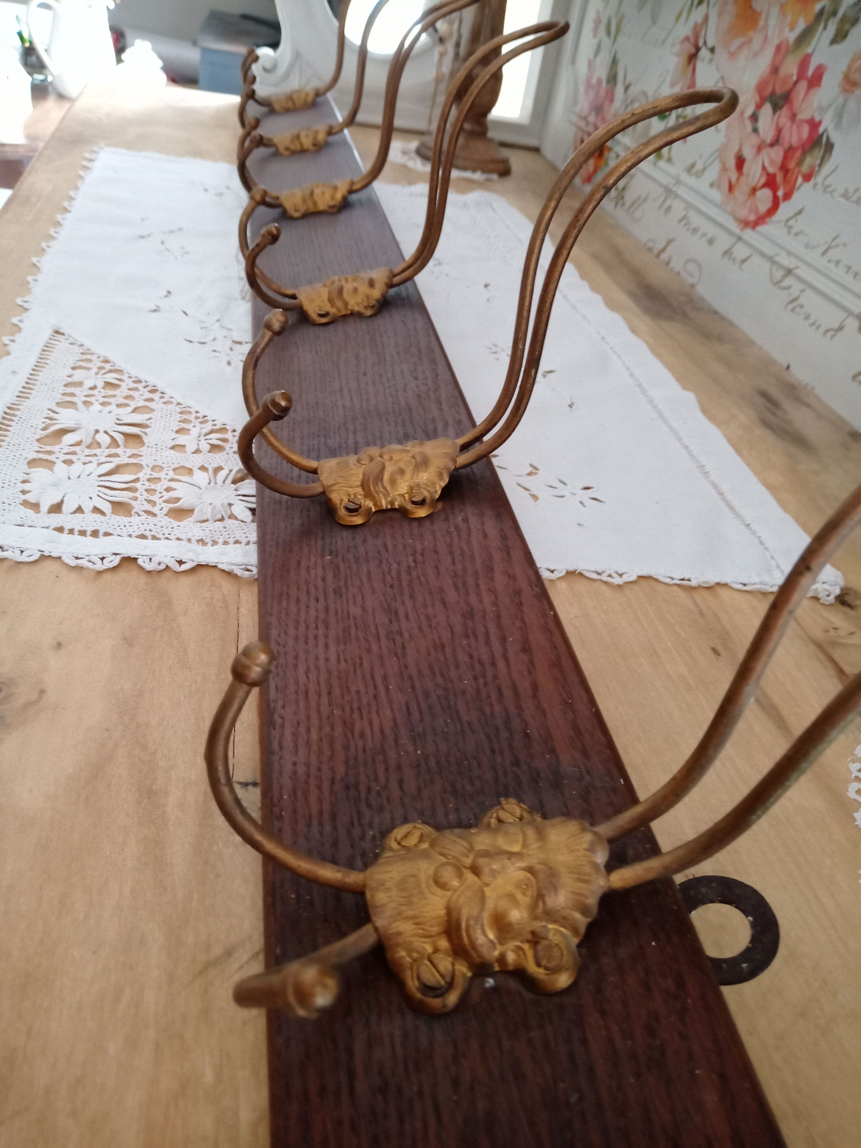 Wall coat rack 6 brass patères form mascarons