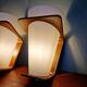 Pair of Philips teak and opaline wall lights, designed by Louis Kalff, 1950