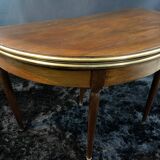 A Louis XVI period mahogany half-moon table forming a console/games table