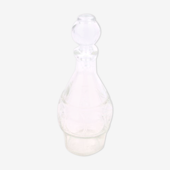 Small bottle with a glass cap with geometric patterns