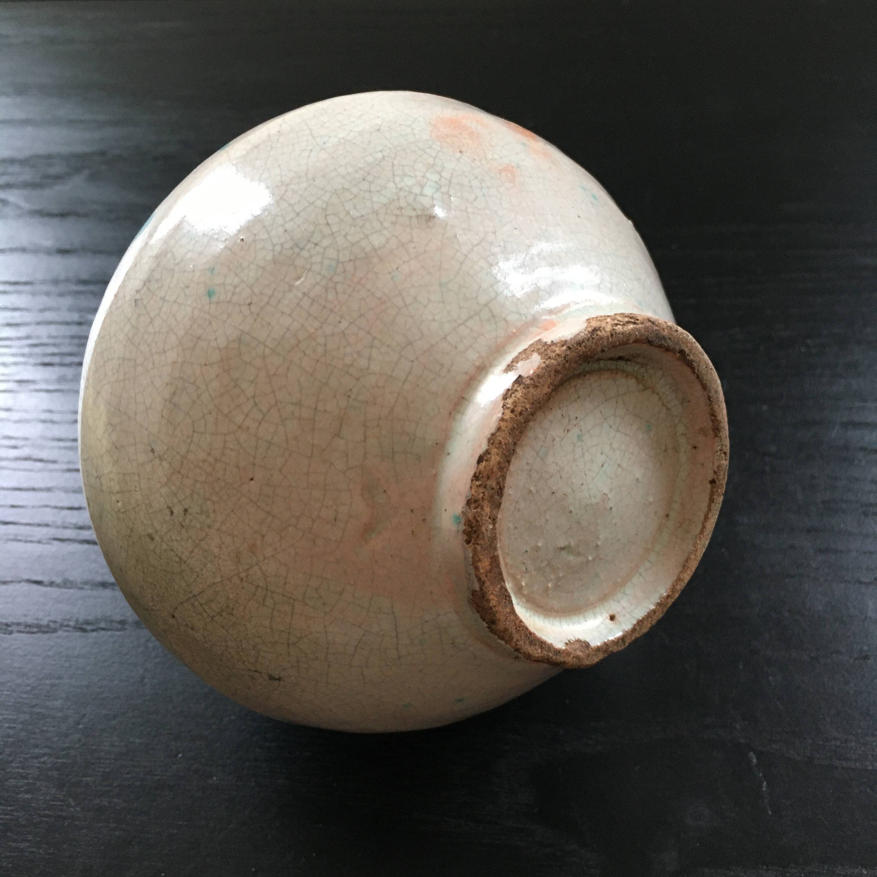 Antique pitcher with floral decoration