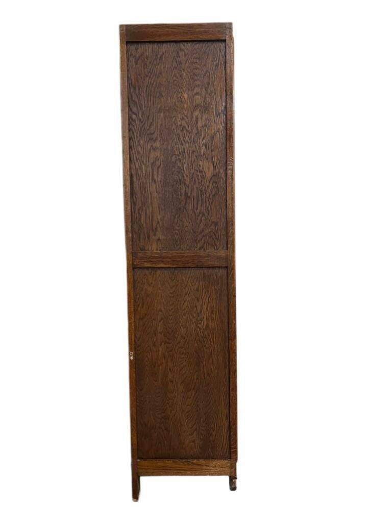 Vintage wooden display cabinet with textured glass.