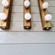 Set of three wall sconces in solid brass, 1970s-80s.