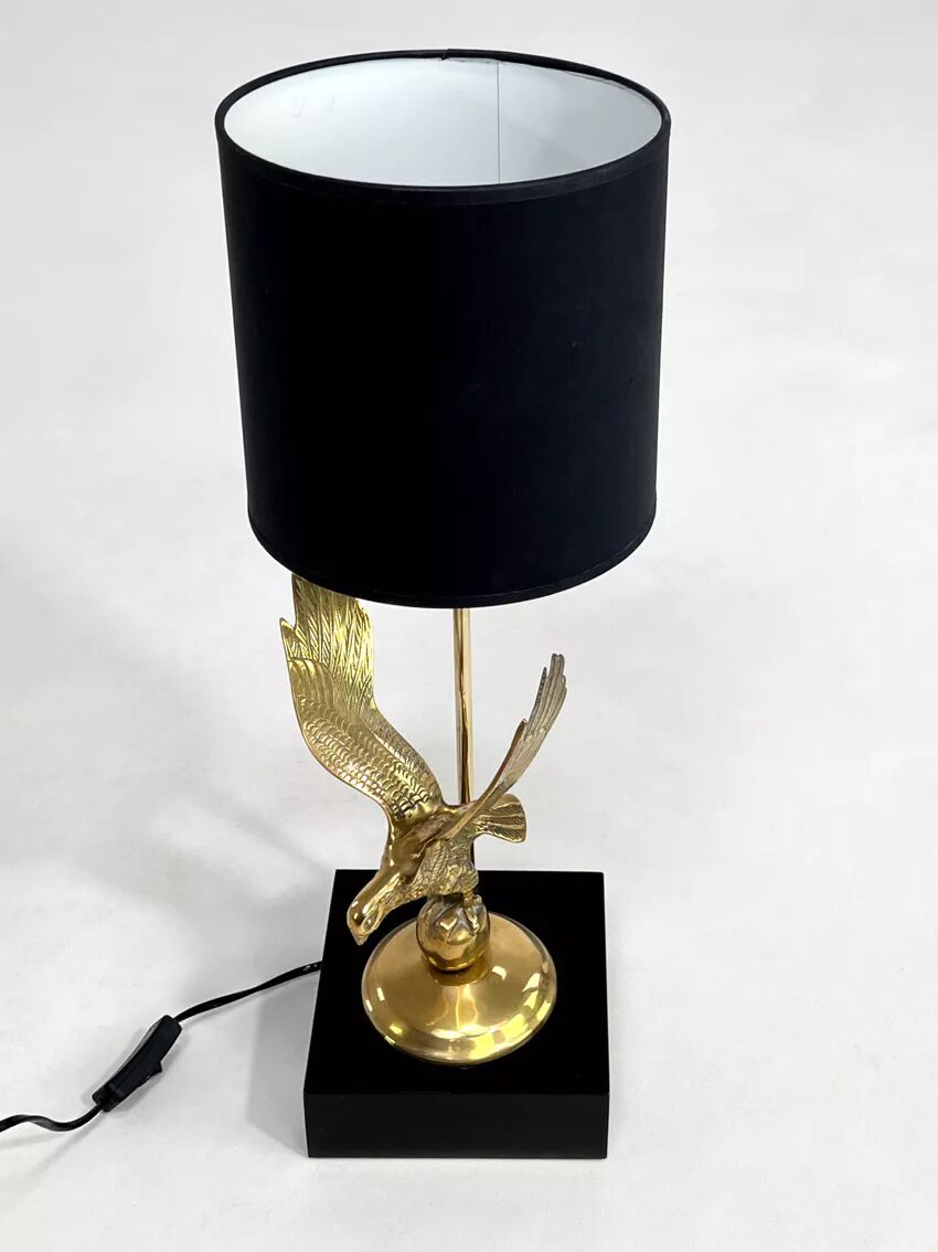 Brass lamp on black lacquered wooden base