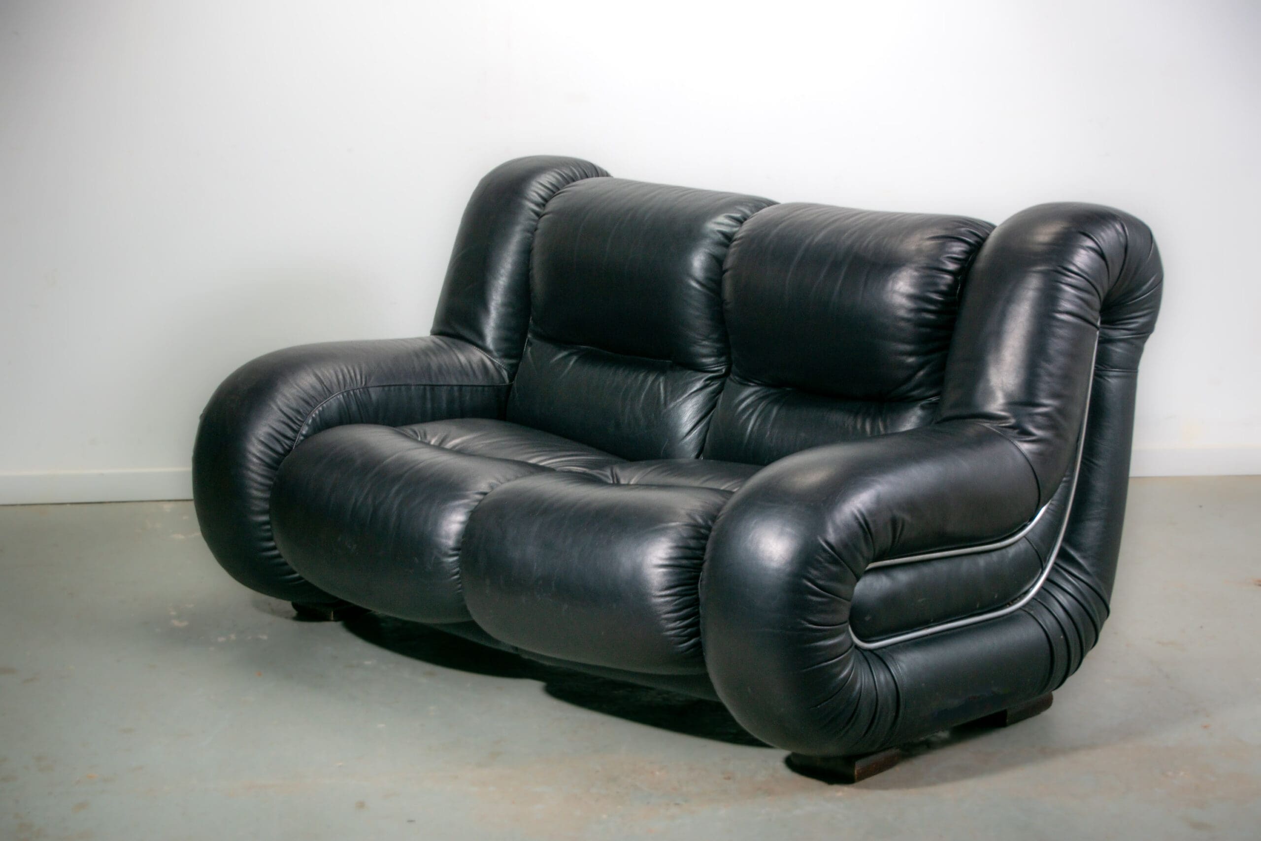 Black leather space age Italian 2 seater sofa