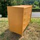 Commode 4 tiroirs vintage en aggloméré plaqué véritable bois