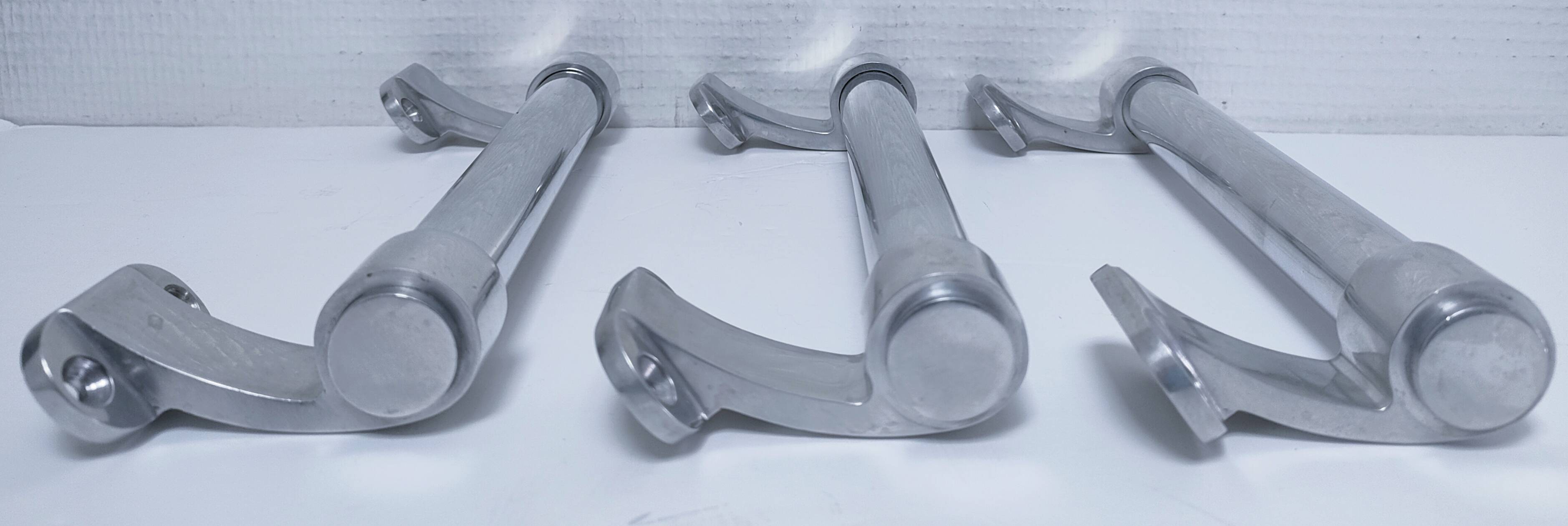 three long aluminum shop handles from the mid-20th century