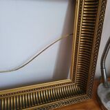 Frame with channels in wood and gilded stucco